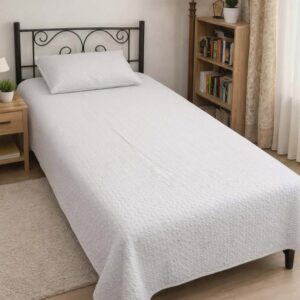 Fabric: Cotton Size: Single Wash Care: Machine washable; gentle cycle recommended Season Suitability: Ideal for all seasons due to breathable cotton Package Includes: 1 Quilted Flat Sheet 60*96 inches 1 Quilted Pillowcase 18*28 inches The bedsheet is a reversible quilted bedspread with a white center panel and a dark gray border featuring a textured chevron pattern. It comes with a matching gray pillowcase and gives a clean, modern look to the single bed setup in the image. NOTE: Due to photographic effect, the color of product may slightly vary to the picture.